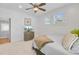 Bright bedroom with white walls, a ceiling fan, and access to an adjacent bathroom at 744 Gate Post Dr, Mount Pleasant, SC 29464
