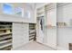 Spacious walk-in closet with custom shelving, drawers, and ample storage for clothes and accessories at 744 Gate Post Dr, Mount Pleasant, SC 29464
