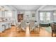 Bright and inviting dining area featuring a light fixture, white trim and hardwood floors at 744 Gate Post Dr, Mount Pleasant, SC 29464