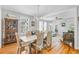Bright and airy dining area featuring a light fixture, hardwood floors and views to the living area at 744 Gate Post Dr, Mount Pleasant, SC 29464