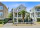Charming, multi-story beach home featuring a landscaped yard, side car port and cross beam railings at 744 Gate Post Dr, Mount Pleasant, SC 29464