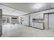 Spacious unfinished garage with white cabinetry, concrete floor, and large sliding glass doors at 744 Gate Post Dr, Mount Pleasant, SC 29464