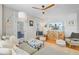 Bright living room with doors to outside, ceiling fan, and modern decor at 744 Gate Post Dr, Mount Pleasant, SC 29464