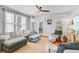 Bright and airy living room featuring a soft color palette, windows and hardwood floors at 744 Gate Post Dr, Mount Pleasant, SC 29464