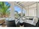 Relaxing screened porch with comfortable seating and view of the neighborhood at 744 Gate Post Dr, Mount Pleasant, SC 29464