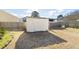 Backyard shed providing extra storage space, nestled in a well-maintained yard with lush surroundings at 7649 Fayetteville Rd, North Charleston, SC 29418