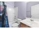 A full bathroom features a shower and tub combination along with a single sink vanity at 7649 Fayetteville Rd, North Charleston, SC 29418