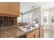 Kitchen sink offers stainless steel hardware, granite countertops, and stainless-steel appliances at 7649 Fayetteville Rd, North Charleston, SC 29418