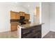 Kitchen with granite countertops, wood cabinetry, and breakfast bar at 7649 Fayetteville Rd, North Charleston, SC 29418