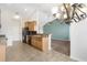 Bright kitchen with granite countertops, stainless steel appliances, and adjoining living area at 7649 Fayetteville Rd, North Charleston, SC 29418