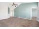 Spacious living room features a blue accent wall, carpeting and natural light at 7649 Fayetteville Rd, North Charleston, SC 29418