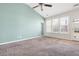 Spacious living room features a blue accent wall, carpeting and ample natural light at 7649 Fayetteville Rd, North Charleston, SC 29418