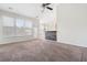 Open-concept living room featuring vaulted ceilings, carpeting and a bar area at 7649 Fayetteville Rd, North Charleston, SC 29418