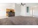 Open-concept living room featuring vaulted ceilings, carpeting and a kitchen view at 7649 Fayetteville Rd, North Charleston, SC 29418