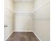 Empty walk-in closet with carpet floor and metal shelving at 7649 Fayetteville Rd, North Charleston, SC 29418