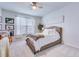 Bedroom featuring a bed, a window with drapes, and a decorative leafy plant at 7720 Kinston St, North Charleston, SC 29418