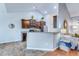 Kitchen open to the living area with dark cabinetry, stainless appliances, and counter seating at 7720 Kinston St, North Charleston, SC 29418