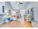 Open-concept living room with hardwood floors, modern decor, and plenty of natural light at 7720 Kinston St, North Charleston, SC 29418