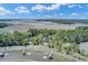 Pictureque aerial view of waterfront homes with private boat docks on a river surrounded by marshland at 8704 Middleton Point Ln, Edisto Island, SC 29438