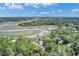 Stunning aerial view of the property, showcasing the marsh, docks, waterway and lush trees at 8704 Middleton Point Ln, Edisto Island, SC 29438