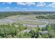 Expansive aerial view highlighting the home's location with its serene marsh and winding waterway at 8704 Middleton Point Ln, Edisto Island, SC 29438