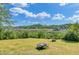 Expansive backyard with a fire pit and scenic views of the marsh, docks, and waterway at 8704 Middleton Point Ln, Edisto Island, SC 29438