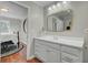 Bright bathroom featuring a modern vanity, mirror and lighting at 8704 Middleton Point Ln, Edisto Island, SC 29438