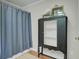 Bathroom featuring a shower with a curtain and antique shelving at 8704 Middleton Point Ln, Edisto Island, SC 29438