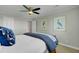 Bright bedroom with tasteful decor featuring a ceiling fan and neutral walls at 8704 Middleton Point Ln, Edisto Island, SC 29438