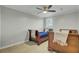 Comfortable bedroom featuring two twin beds, ceiling fan and natural light at 8704 Middleton Point Ln, Edisto Island, SC 29438