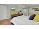 Airy bedroom featuring a bed, television, and a bright interior with a view to another part of the house at 8704 Middleton Point Ln, Edisto Island, SC 29438
