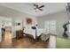 Cozy bedroom with hardwood floors and large windows for natural light at 8704 Middleton Point Ln, Edisto Island, SC 29438
