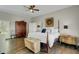 Charming bedroom with hardwood floors, vintage touches and natural light at 8704 Middleton Point Ln, Edisto Island, SC 29438