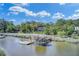 Waterfront home with a private boat dock and covered gazebo extending into the waterway, perfect for boating at 8704 Middleton Point Ln, Edisto Island, SC 29438