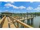 Waterfront property featuring private dock with boat lift and gazebo at 8704 Middleton Point Ln, Edisto Island, SC 29438