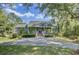Charming home with large front porch, brick stairs and lush landscaping at 8704 Middleton Point Ln, Edisto Island, SC 29438