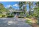 Charming home with large front porch, brick stairs and lush landscaping at 8704 Middleton Point Ln, Edisto Island, SC 29438