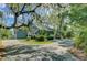 Beautiful home with mature landscaping and circular driveway at 8704 Middleton Point Ln, Edisto Island, SC 29438