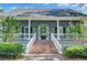 Inviting front porch with brick stairs and classic architectural details at 8704 Middleton Point Ln, Edisto Island, SC 29438