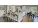 Bright kitchen features a large island with seating and modern appliances at 8704 Middleton Point Ln, Edisto Island, SC 29438