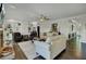 This spacious living room features built-in bookshelves, neutral furniture, and hardwood floors at 8704 Middleton Point Ln, Edisto Island, SC 29438