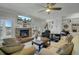 This living room offers hardwood floors, built-in bookshelves, a brick fireplace, and neutral decor at 8704 Middleton Point Ln, Edisto Island, SC 29438