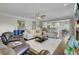 Spacious living room featuring hardwood floors, neutral furniture, and an open layout concept at 8704 Middleton Point Ln, Edisto Island, SC 29438