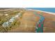 Stunning aerial view of a waterfront property with private docks along a scenic marsh, offering direct access to the ocean at 944 Hammocks Way, Edisto Island, SC 29438