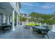 Inviting back deck with outdoor seating and green wicker furniture at 944 Hammocks Way, Edisto Island, SC 29438