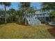 Beautiful backyard with a grand staircase leading to the house and well-manicured landscaping at 944 Hammocks Way, Edisto Island, SC 29438