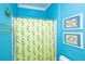 Bathroom featuring a unique shower curtain, wall decor, and updated fixtures at 944 Hammocks Way, Edisto Island, SC 29438