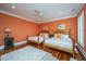 Bedroom with twin beds, wood floors, and natural light at 944 Hammocks Way, Edisto Island, SC 29438