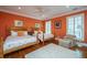 Bedroom with twin beds, hardwood floors, and a seating area with a chair at 944 Hammocks Way, Edisto Island, SC 29438
