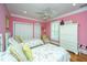 Shared bedroom with twin beds, closet storage, and coordinated decor at 944 Hammocks Way, Edisto Island, SC 29438